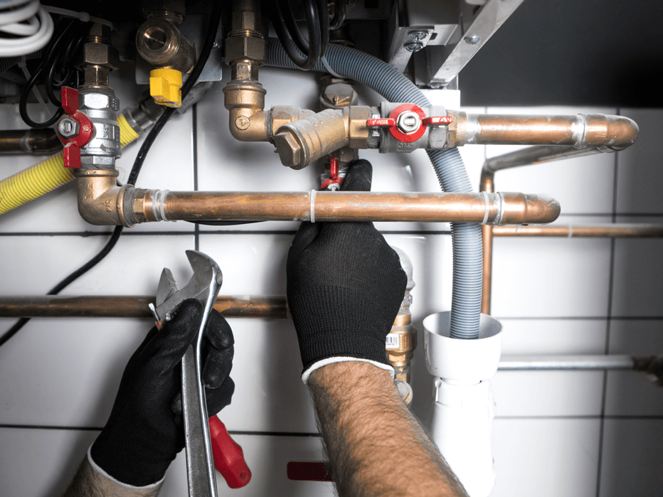 Repairing pipes with a wrench.