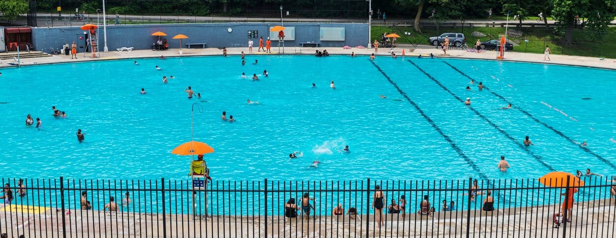 People swimming in an outdoor pool in New York