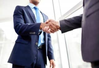 Two Lawyers Shaking Hands