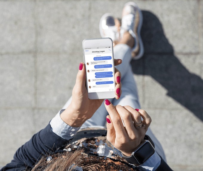 Woman using social media apps on a smartphone